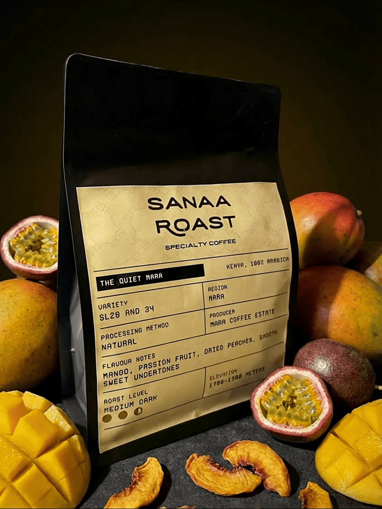 Coffee farmer harvesting red coffee cherries